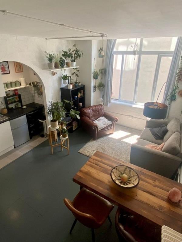 Story from Jam Press (Studio With Plants) Pictured: Inside the tiny studio flat. Plant potty! Tenants asked to water landlady?s 24 pot plants if they rent tiny 1,600-a-mo<em></em>nth studio flat A tiny studio flat is being let for a whopping 1,600-a-mo<em></em>nth and tenants have to water the landlady?s TWENTY FOUR pot plants, too. The one-bed pad is so cramped the bed is on a bespoke shelf with no headroom. It is accessed via a steep ladder and there is a desk to WFH underneath, plus a wardrobe and drawers. There is a two-seater sofa and a dining table with four seats near the pokey kitchenette. The separate bathroom has a shower cubicle, toilet and basin. Bills, except electricity, are included, but there is no parking or a garden, and pets are banned. But tenants are expected to water the plants described as ?o<em></em>nly a few.? The listing reads: ?Taking care of the owner's plants would be greatly appreciated, but not burdensome. ?As there are o<em></em>nly a few as shown in the pictures.? But twenty-two can be seen mainly in the living room area on shelves and tables, but there is also one in the toilet. The bedsit, in Schwartz Wharf, Hackney Wick, east London, is being let by OpenRent. As well as the sky-high rent a deposit of 1,846.15 is also required. The full listing reads: ?Be the first to call this fully furnished studio flat your own. ?This tastefully decorated and fully equipped apartment offers all the comforts of modern living. ?Featuring a fully stocked kitchen with all necessary appliances and kitchenware, you'll have everything you need to whip up delicious meals from the comfort of your own home. ?And with all bills included, including a fast fibre Internet connection, you'll have one less thing to worry a<em></em>bout each month. ?The o<em></em>nly excluded utility is electricity, which you'll be respo<em></em>nsible for. ?You'll find a cosy living space that's perfect for one person. ?The flat faces the serene bike parking area, ensuring a quiet and