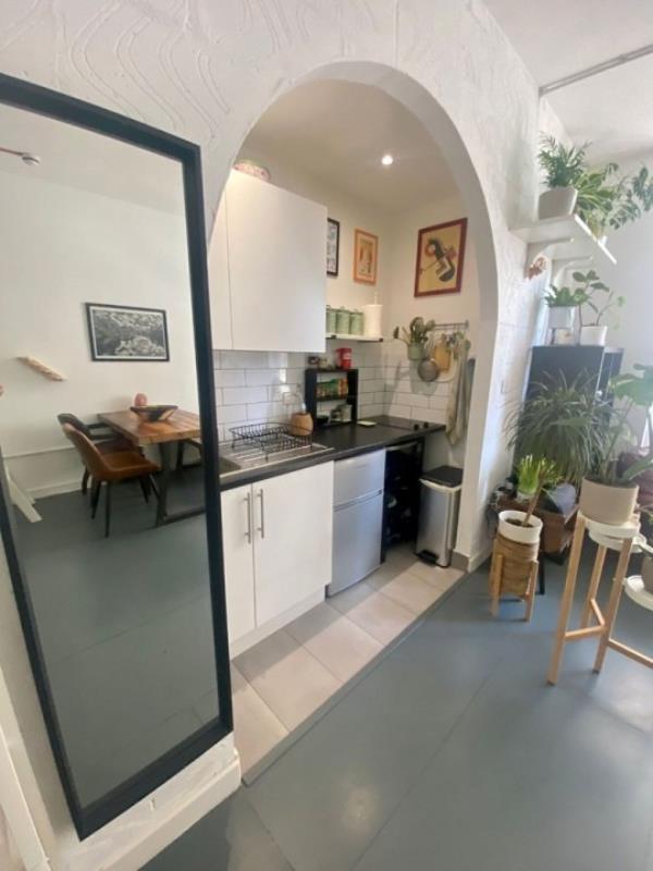 Story from Jam Press (Studio With Plants) Pictured: Inside the tiny studio flat. Plant potty! Tenants asked to water landlady?s 24 pot plants if they rent tiny 1,600-a-mo<em></em>nth studio flat A tiny studio flat is being let for a whopping 1,600-a-mo<em></em>nth and tenants have to water the landlady?s TWENTY FOUR pot plants, too. The one-bed pad is so cramped the bed is on a bespoke shelf with no headroom. It is accessed via a steep ladder and there is a desk to WFH underneath, plus a wardrobe and drawers. There is a two-seater sofa and a dining table with four seats near the pokey kitchenette. The separate bathroom has a shower cubicle, toilet and basin. Bills, except electricity, are included, but there is no parking or a garden, and pets are banned. But tenants are expected to water the plants described as ?o<em></em>nly a few.? The listing reads: ?Taking care of the owner's plants would be greatly appreciated, but not burdensome. ?As there are o<em></em>nly a few as shown in the pictures.? But twenty-two can be seen mainly in the living room area on shelves and tables, but there is also one in the toilet. The bedsit, in Schwartz Wharf, Hackney Wick, east London, is being let by OpenRent. As well as the sky-high rent a deposit of 1,846.15 is also required. The full listing reads: ?Be the first to call this fully furnished studio flat your own. ?This tastefully decorated and fully equipped apartment offers all the comforts of modern living. ?Featuring a fully stocked kitchen with all necessary appliances and kitchenware, you'll have everything you need to whip up delicious meals from the comfort of your own home. ?And with all bills included, including a fast fibre Internet connection, you'll have one less thing to worry a<em></em>bout each month. ?The o<em></em>nly excluded utility is electricity, which you'll be respo<em></em>nsible for. ?You'll find a cosy living space that's perfect for one person. ?The flat faces the serene bike parking area, ensuring a quiet and