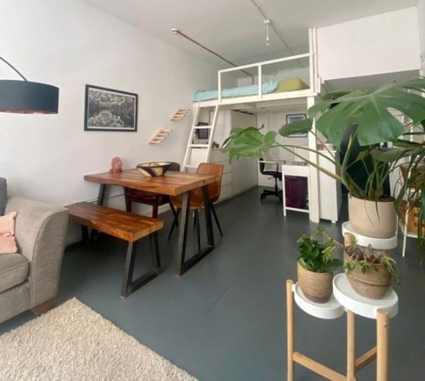 Story from Jam Press (Studio With Plants) Pictured: Inside the tiny studio flat. Plant potty! Tenants asked to water landlady?s 24 pot plants if they rent tiny 1,600-a-mo<em></em>nth studio flat A tiny studio flat is being let for a whopping 1,600-a-mo<em></em>nth and tenants have to water the landlady?s TWENTY FOUR pot plants, too. The one-bed pad is so cramped the bed is on a bespoke shelf with no headroom. It is accessed via a steep ladder and there is a desk to WFH underneath, plus a wardrobe and drawers. There is a two-seater sofa and a dining table with four seats near the pokey kitchenette. The separate bathroom has a shower cubicle, toilet and basin. Bills, except electricity, are included, but there is no parking or a garden, and pets are banned. But tenants are expected to water the plants described as ?o<em></em>nly a few.? The listing reads: ?Taking care of the owner's plants would be greatly appreciated, but not burdensome. ?As there are o<em></em>nly a few as shown in the pictures.? But twenty-two can be seen mainly in the living room area on shelves and tables, but there is also one in the toilet. The bedsit, in Schwartz Wharf, Hackney Wick, east London, is being let by OpenRent. As well as the sky-high rent a deposit of 1,846.15 is also required. The full listing reads: ?Be the first to call this fully furnished studio flat your own. ?This tastefully decorated and fully equipped apartment offers all the comforts of modern living. ?Featuring a fully stocked kitchen with all necessary appliances and kitchenware, you'll have everything you need to whip up delicious meals from the comfort of your own home. ?And with all bills included, including a fast fibre Internet connection, you'll have one less thing to worry a<em></em>bout each month. ?The o<em></em>nly excluded utility is electricity, which you'll be respo<em></em>nsible for. ?You'll find a cosy living space that's perfect for one person. ?The flat faces the serene bike parking area, ensuring a quiet and