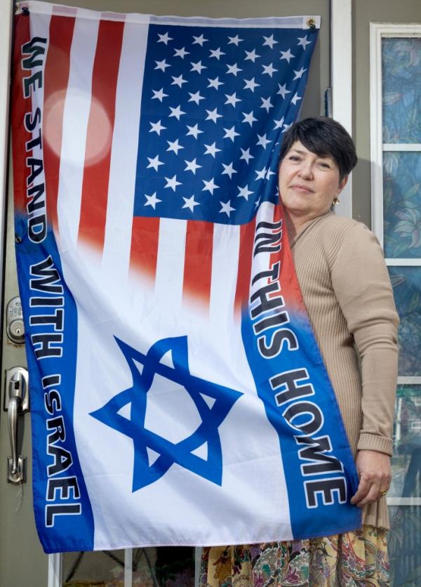 Esther Shali - Ogli poses with israeli/american flag