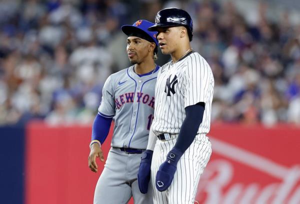 Juan Soto #22 of the New York Yankees stands at second ba<em></em>se with Francisco Lindor #12 of the New York Mets