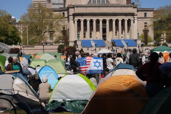 Pro-Israel protestors gather at a pro-Palestinian encampment on the lawn of Columbia University.