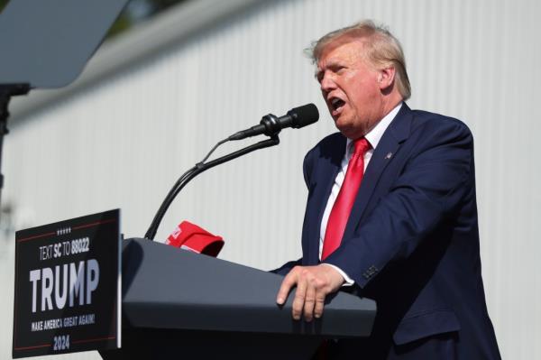 Former President Trump speaking at a podium