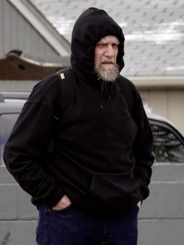 Gary Oliva, the sex offender who co<em></em>nfessed to killing Jo<em></em>nBenet Ramsey, is seen for the first time after being released from prison pictured outside the halfway house wher<em></em>e he is residing in Denver, seen wearing black hooded sweatshirt.