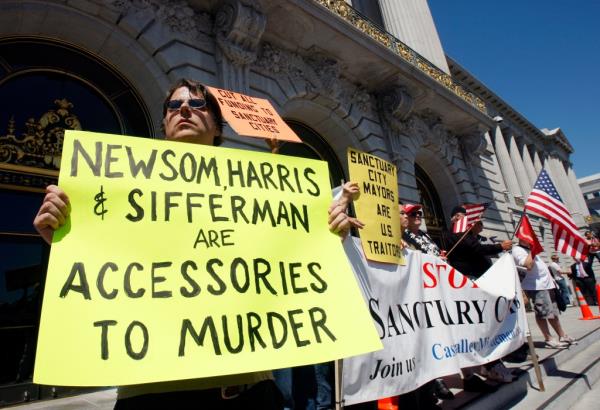 David Karner, left, and a<em></em>bout a dozen MInutemen and their supporters stands on the steps of City Hall to call for Mayor Gavin Newsom's resignation in San Francisco, Calif., on Wednesday, July 30, 2008.