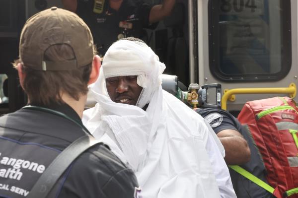 An assault victim being transported from inside the Zara Store on Broadway in Soho, saturday afternoon.