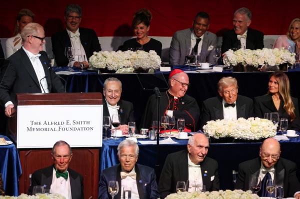 Jim Gaffigan delivering a speech at the 79th annual Alfred E. Smith Memorial Foundation Dinner with Do<em></em>nald and Melania Trump among attendees