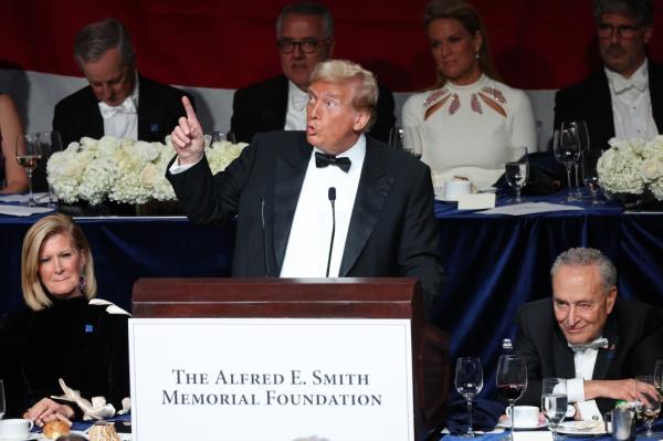 Former President Do<em></em>nald Trump giving a speech at the Alfred E. Smith Dinner in New York City, with celebrities including Charles Ellis Schumer and Martha MacCallum in attendance