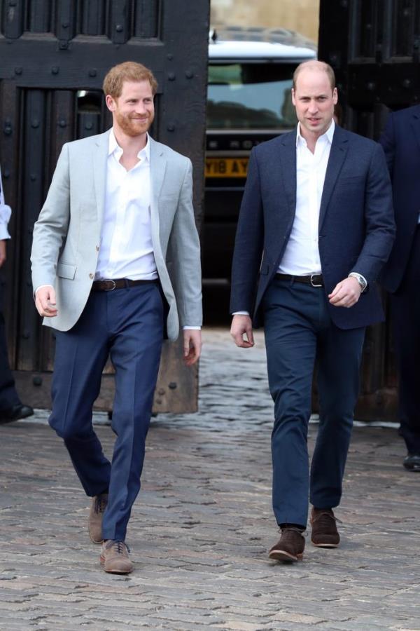 Prince Harry and Prince William, Duke of Cambridge, meeting the public on a brick road in Windsor, England prior to the royal wedding.