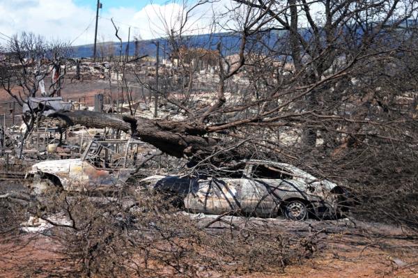 Destroyed property is seen, Sunday, Aug. 13, 2023, in Lahaina, Hawaii, following a deadly wildfire that caused heavy damage days earlier. 