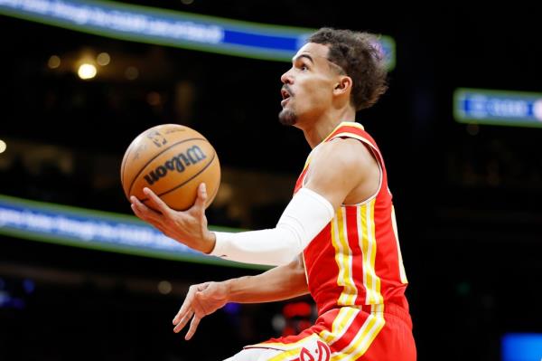 Trae Young #11 of the Atlanta Hawks goes to the basket against the Brooklyn Nets during the first half at State Farm Arena