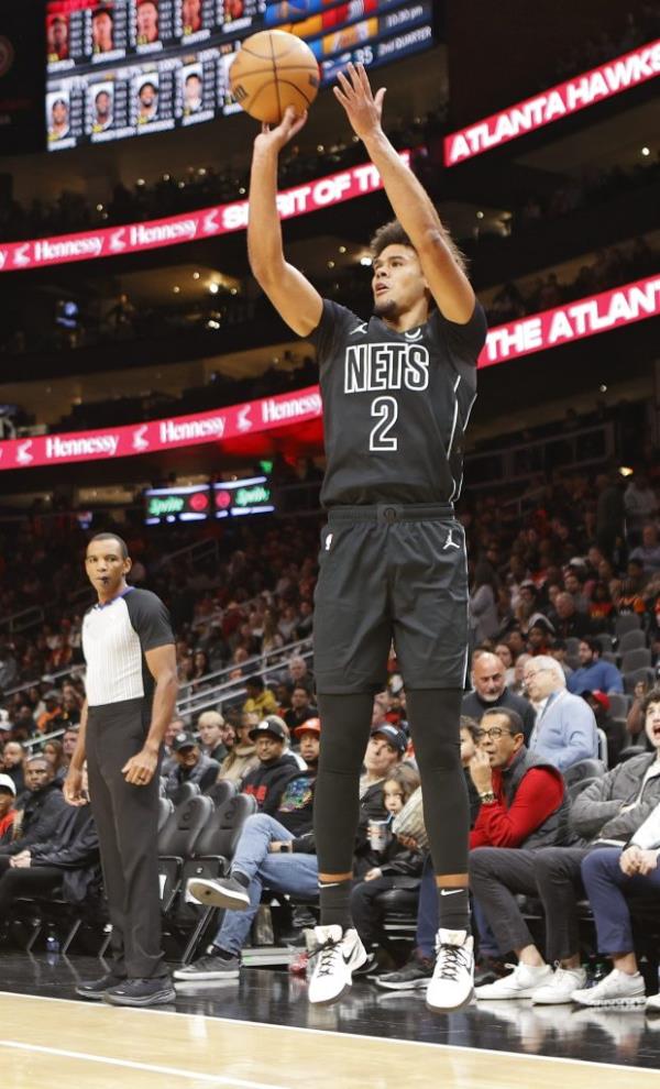 Cameron Johnson #2 of the Brooklyn Nets shoots a three point basket during the game against the Atlanta Hawks on NOVEMBER 22, 2023 at State Farm Arena in Atlanta, Georgia.