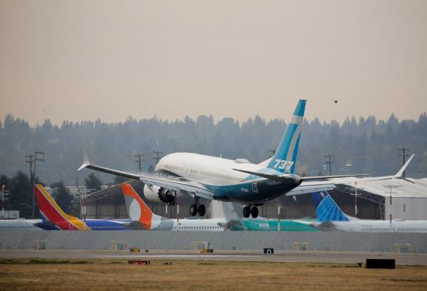 A Boeing 737 MAX 7 aircraft piloted by FAA Chief Steve Dickson landing during an e<em></em>valuation flight at Boeing Field in Seattle, Washington