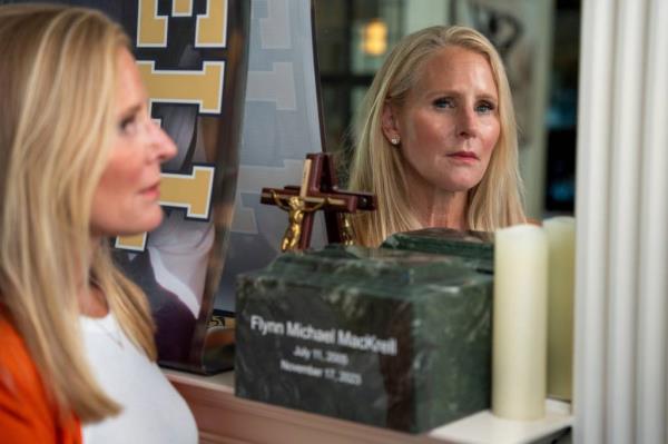 Anne Vanker, of Grosse Pointe, stands by the ashes of her late son Flynn MacKrell at her home in Grosse Pointe on Friday, July 26, 2024. 