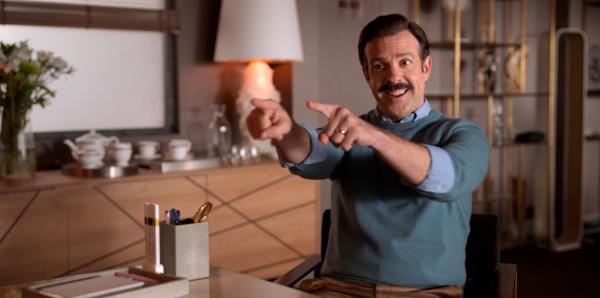 Jason Sudeikis smiling and pointing. 