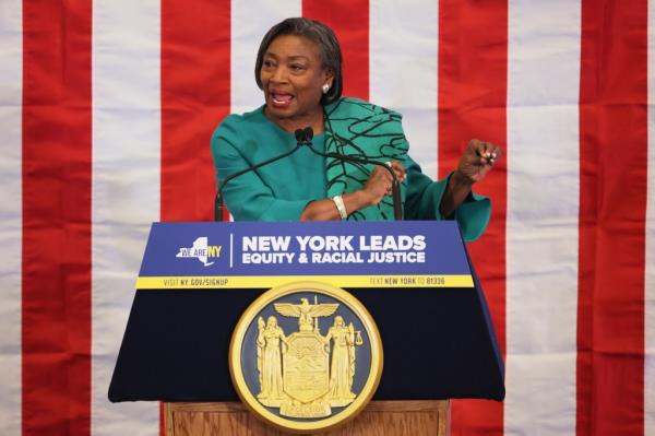 New York Senate Majority Leader Andrea Stewart-Cousins speaking at podium during press co<em></em>nference and signing of racial justice legislation.