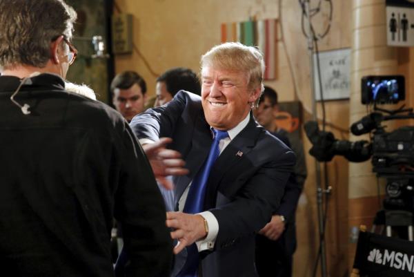 Do<em></em>nald Trump jokes with host Joe Scarborough after an appearance on MSNBC's Morning Joe cable television show at Java Joe's CoffeeHouse in Des Moines, Iowa, January 15, 2016. 