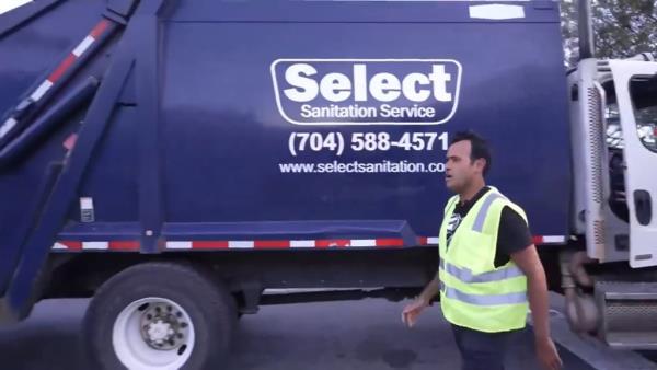 He said it was the first time he's ridden in a garbage truck.