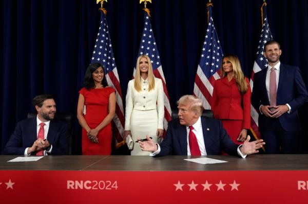 Usha Chilukuri Vance, Ivanka Trump, former first lady Melania Trump and Eric Trump watch, Republican presidential candidate former President Do<em></em>nald Trump and Republican vice presidential candidate Sen. JD Vance, R-Ohio, sign paperwork to officially accept the nominations during the final day of the Republican Natio<em></em>nal Co<em></em>nvention at the Fiserv Forum, Thursday, July 18, 2024, in Milwaukee.