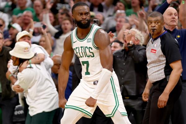 Jaylen Brown #7 of the Boston Celtics reacts after making a 3 pointer to tie the game late during the fourth quarter of Game 1.