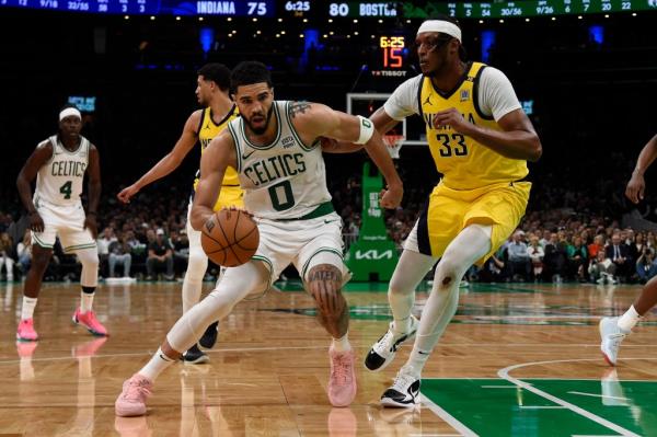 Jayson Tatum drives to the basket during the Celtics' Game 1 overtime win.