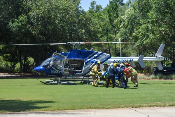 First respo<em></em>nders lift the victim into a helicopter