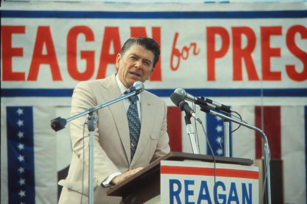 Ro<em></em>nald Reagan standing at a podium, speaking to an audience during his 1976 presidential campaign in Indiana