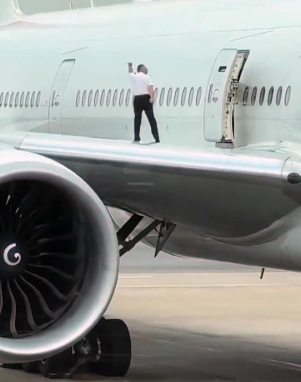 Image shows two of the flight attendants posing, undated photo. The Swiss flight attendants were caught taking snaps on the wing of a Boeing 777 in the city of Buenos Aires, Argentina. (@spottersbrasil/CEN)