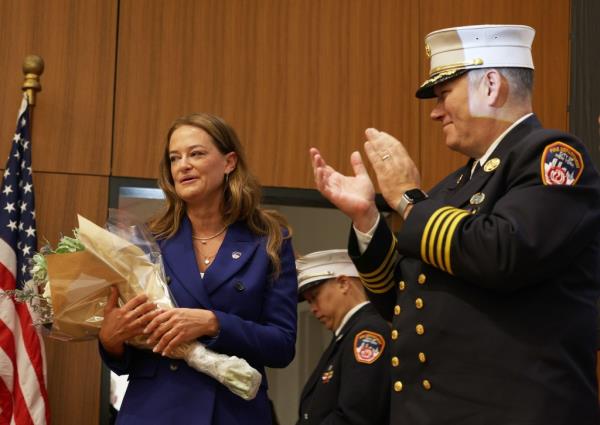 An emotio<em></em>nal FDNY Commissio<em></em>ner Laura Kavanagh with Acting Chief of Department John Esposito, at the FDNY EMS Lieutenant Promotion at St. John's University.