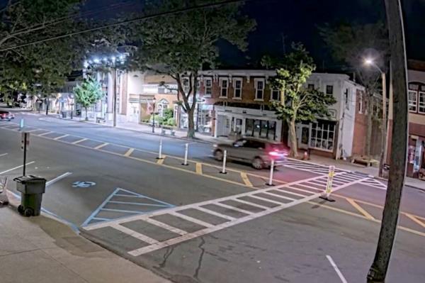 Justin Timberlake's BMW driving through Main Street in Sag Harbor, captured on a nearby surveillance camera at night