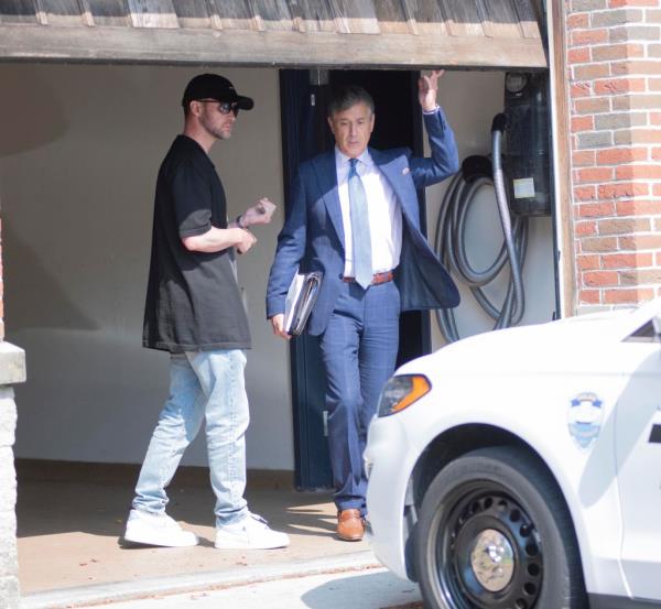 Justin Timberlake with his attorney Edward Burke Jr. exiting a building after his arraignment in Sag Harbor, charged with DWI.