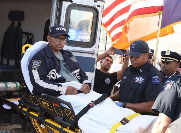 Showing NYPD police officer Christopher Campos from the 81th Police precinct, been released from Elmhurst Hospital 