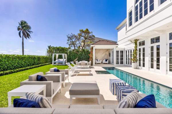 The backyard features a lap pool.