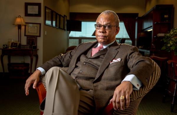 Rev. Calvin O. Butts sitting in his office at SUNY Old Westbury in 2019