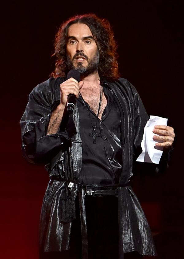 Russell Brand speaks o<em></em>nstage during MusiCares Person of the Year.