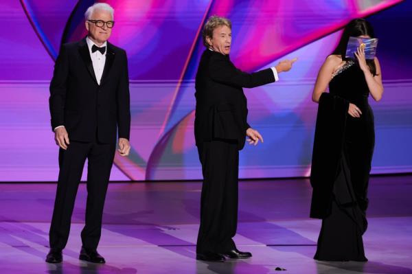 Steve Martin, Martin Short, and Selena Gomez cracking jokes at each other on the stage.