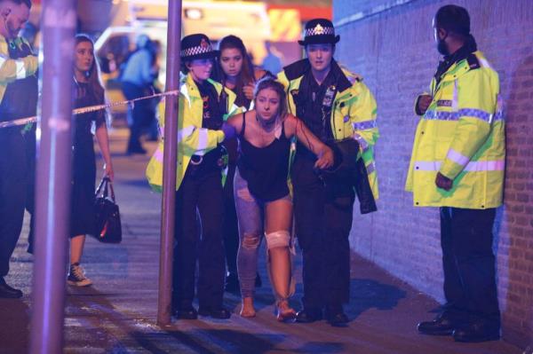 Police and other emergency services are seen near the Manchester Arena after a bomb went off at an Ariana Grande co<em></em>ncert on May 22, 2017.