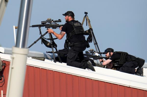 Police snipers return fire after shots were fired while Republican presidential candidate former President Do<em></em>nald Trump 