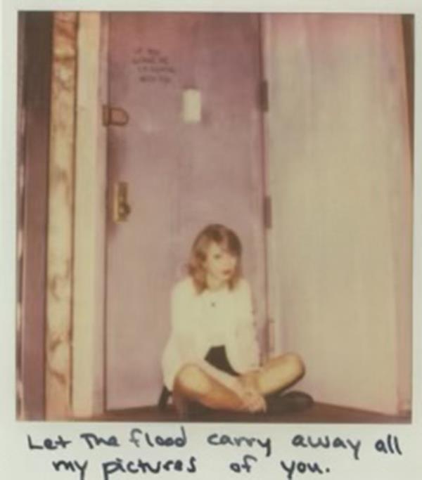 Polaroid of Taylor Swift by the home's front door. 