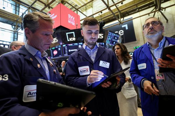 Traders work on the floor of the New York Stock Exchange