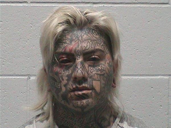 The tattooed Wynn Kiven Satterlee II has a prior felony conviction, and is being held on $60,000 bail