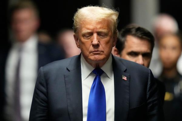 Former President Do<em></em>nald Trump walking towards the media to comment after his felony co<em></em>nviction at Manhattan Criminal Court