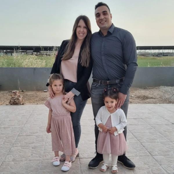 Yoni Asher with his wife and daughters.