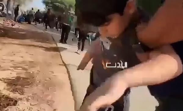 A terrifying video shows a boy believed to be Erez being manhandled by Hamas gunmen.