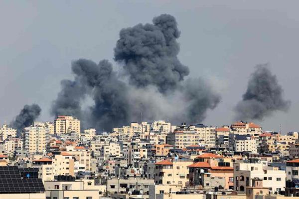 Smoke billows over the Gaza City on October 7, 2023 during Israeli air strike.