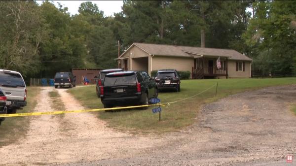 Police at Gray's house after the shooting.