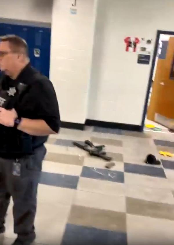 The gun used in the school shooting seen on the ground.