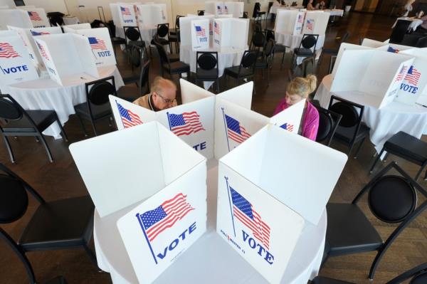 Voters filling out their ballots for the Michigan primary election on Feb. 27, 2024, in Grosse Pointe Farms, Michigan.