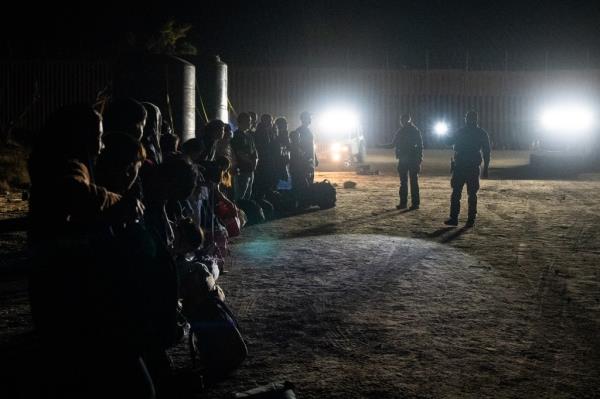 Migrants are processed by U.S. Border Patrol agents after crossing into U.S. from Mexico through an abando<em></em>ned railroad on June 28, 2024 in Jacumba Hot Springs, San Diego, California.