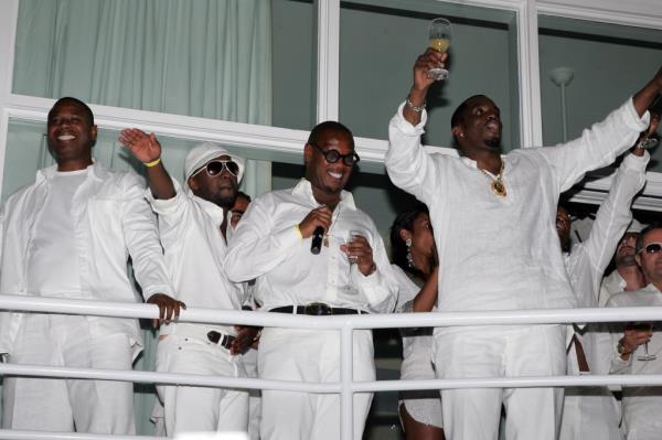 Sean 'Diddy' Combs, Doug E Fresh, and Andre Herrel dressed in white at 'The Real White Party' in East Hampton, New York.